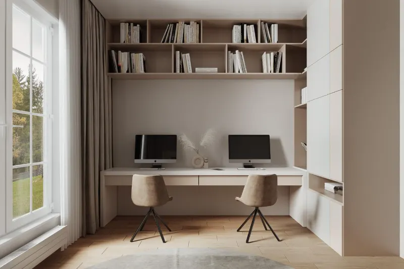 Two wooden desks placed side by side against a white wall.